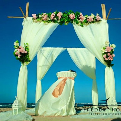 Bamboo archway with material draped