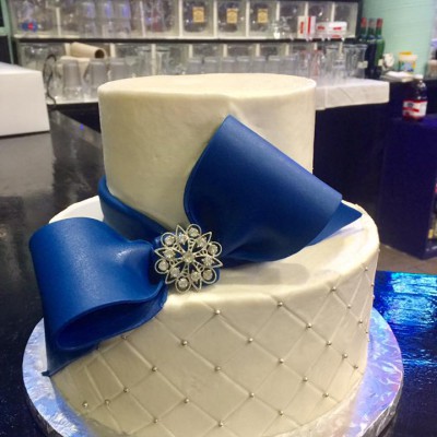 Navy blue cake with fondant bow