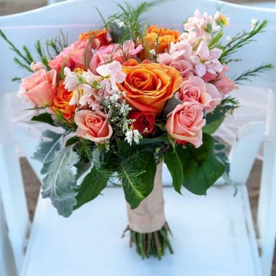 Orange and pink rose bouquet with greenery