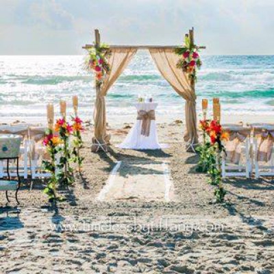 bamboo archway with burlap and flowers