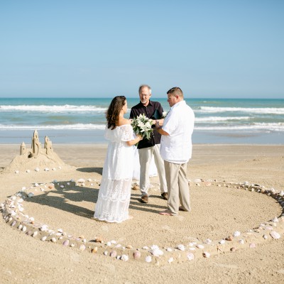 Sea shell heart and sand castle